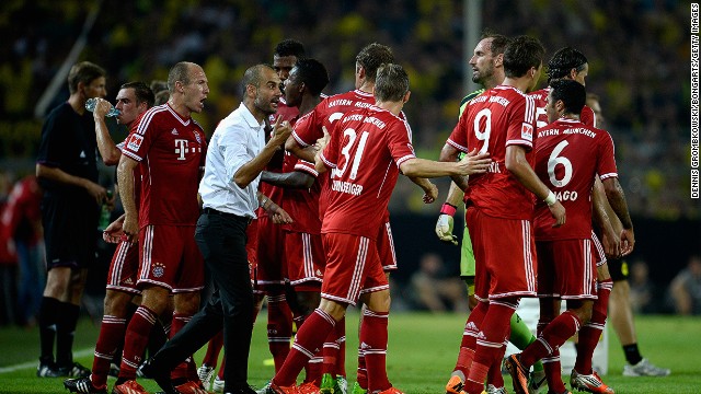 Pep Guardiola encourages Bayern Munich players during the match at the Signal Inuna Park. 