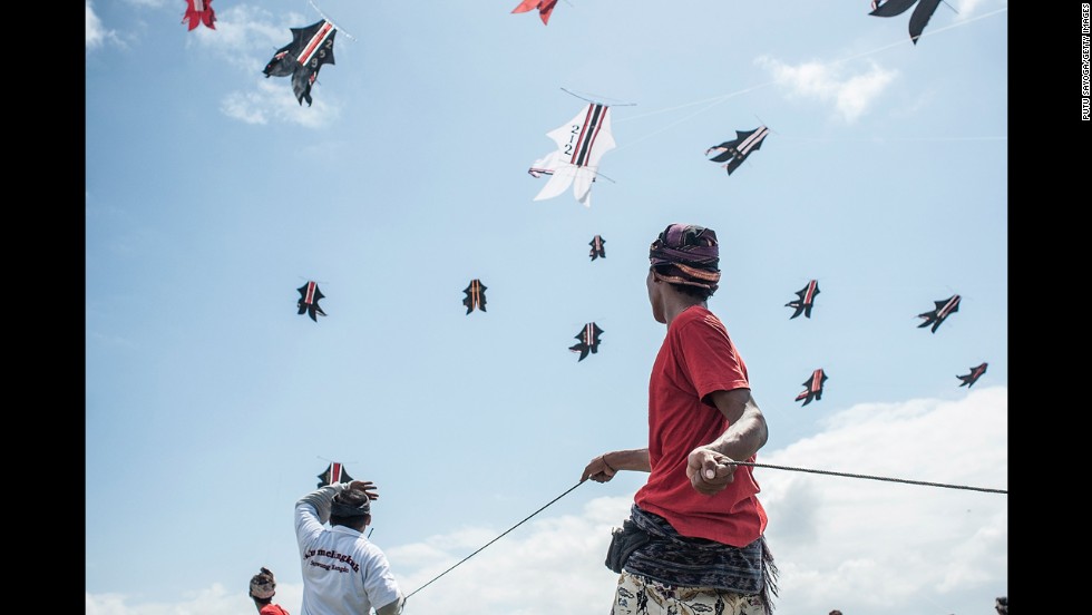 People fly kites during the Bali Kite Festival in Denpasar, Indonesia, on Saturday, July 27.