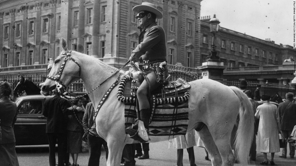 The Lone Ranger character spawned novels, comic books, a TV series and films around the world. Here Moore visits London&#39;s Buckingham Palace in costume as part of an appearance on BBC radio and TV in 1958.