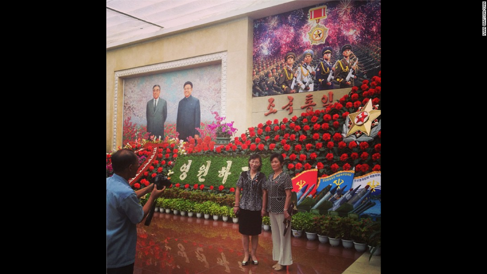 &quot;This was most tightly controlled restricted foreign assignment of my career,&quot; Watson said of his visit to the country. Here &lt;a href=&quot;http://instagram.com/p/cNgHU6CDbv/&quot; target=&quot;_blank&quot;&gt;visitors take souvenir photos&lt;/a&gt; at the Kimilsungia and Kimjongilia flower festival. The flowers are named after former North Korean leaders Kim Il Sung and Kim Jong Il, who overlook the scene from the painting on the left hand side.