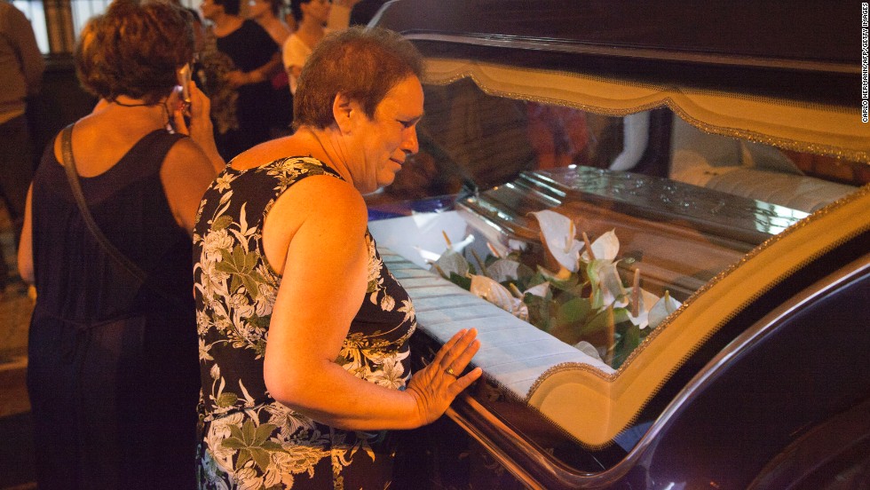 A woman is among the mourners in Pozzuoli on July 29.