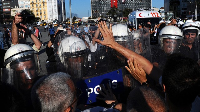 Turkish police beat protesters