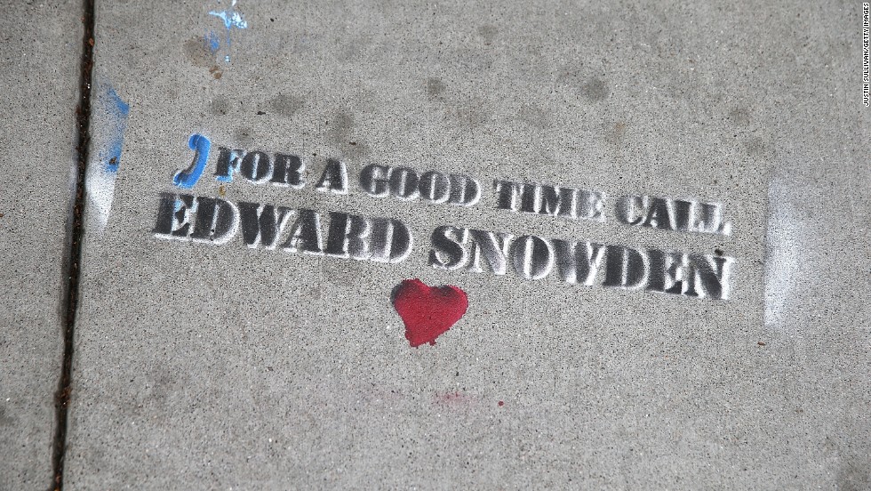 Graffiti sympathetic to Snowden is stenciled on the sidewalk in San Francisco on June 11.
