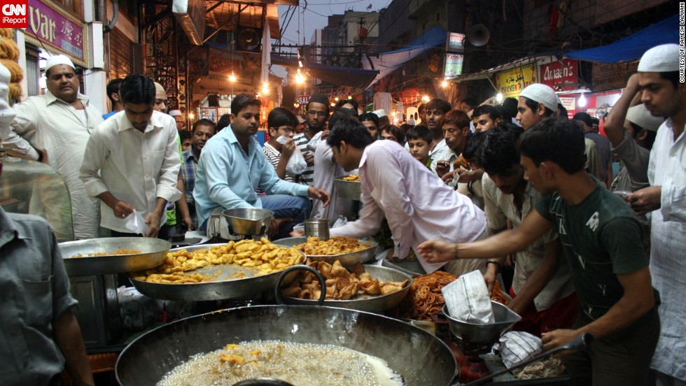 The hustle and bustle of the &lt;a href=&quot;http://ireport.cnn.com/docs/DOC-1012895&quot; target=&quot;_blank&quot;&gt;Matia Mahal bazaar&lt;/a&gt; close to Old Delhi&#39;s principal mosque Jama Masjid was captured on film by 70-year-old Ramesh Lalwani. The samosas are in the process of being fried and the pakoras, jalebis and gulab jamuns are ready for sale to the Eid crowds. 