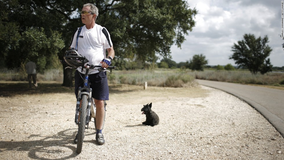 President George W. Bush rides a bicycle at his ranch in Crawford, Texas, in August 2007.