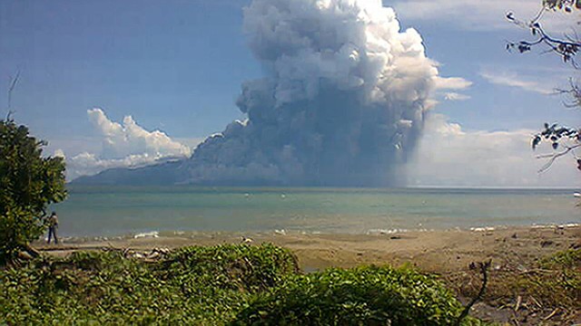 The Mount Rokatenda volcano spews a huge column of hot ash during an eruption on August 10, 2013. 