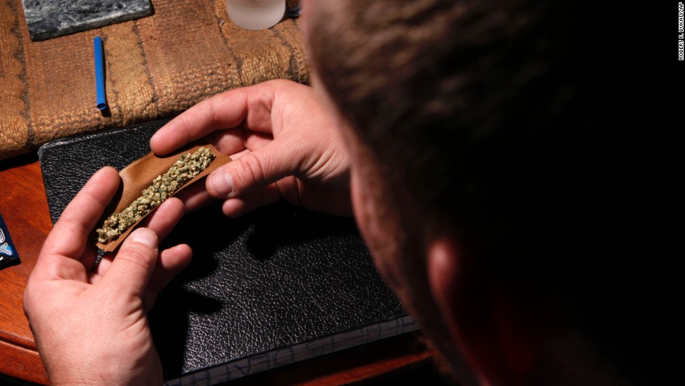 A patient prepares to smoke at home in Portland, Maine, on October 22, 2009, a decade after the state approved a medical marijuana referendum.