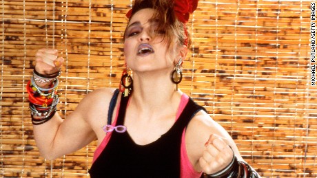 Madonna&#39;s look in 1984 - layered tops, dark makeup and bracelets, bracelets and more bracelets. 