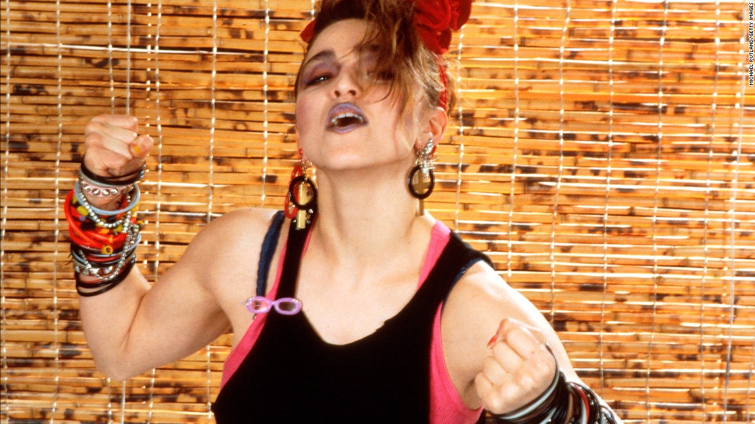 Madonna&#39;s look in 1984: layered tops, dark makeup and bracelets, bracelets and more bracelets.