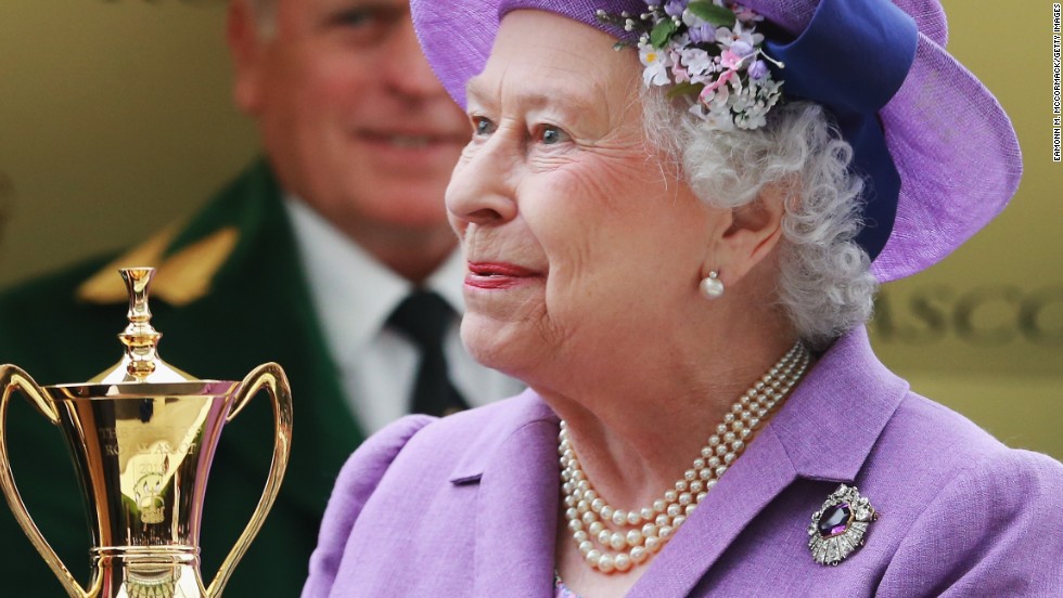 Queen Elizabeth II is all smiles after receiving the Gold Cup following her horse Estimate&#39;s triumph at Royal Ascot.