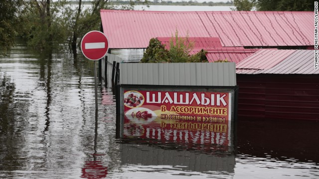 Flood waters hide the streets in Blagoveshchensk, Russia, on Friday, August 16. Aid was being flown into the city on Saturday.