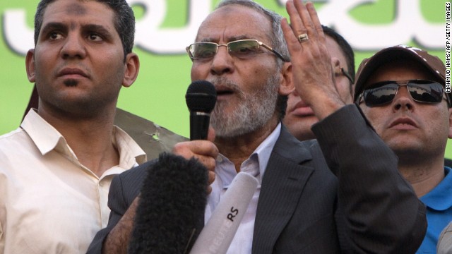 File: Mohammed Badie, center, leader of Egypt&#39;s Muslim Brotherhood, addresses supporters in Cairo in July 2013. An Egyptian court upheld the death sentences against Badie and 182 of the Brotherhood&#39;s supporters on Saturday.