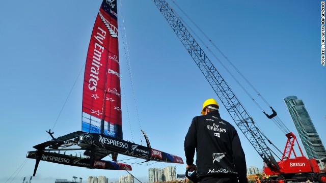Team NZ&#39;s AC-72 racing yacht is lowered into San Francisco Bay for an 2013 America&#39;s Cup training session.
