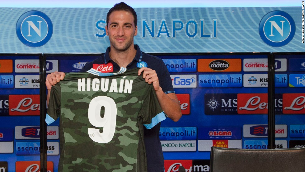 Napoli has invested heavily in new players during the transfer window in the hope it can launch a serious title challenge. Striker Gonzalo Higuain, seen here holding the club&#39;s new camouflage away kit, was signed from Real Madrid. Experienced manager Rafael Benitez, a European Champions League winner with Liverpool in 2005, has also been brought in as coach.
