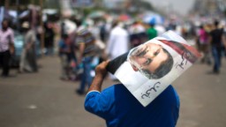 130824214422 egypt protesters morsy poster hp video Mohamed Morsy gets trial date as Egypt turmoil continues