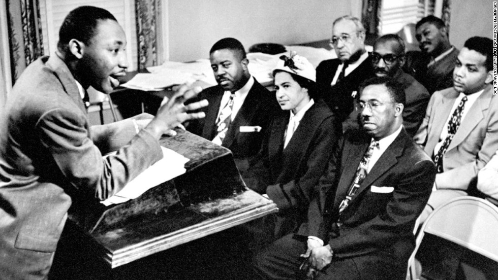 King outlines boycott strategies to his advisers and organizers on January 27, 1956. Seated are the Rev. Ralph Abernathy, left, and Rosa Parks, center, who was the catalyst for the protest of bus riders.