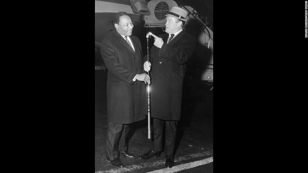 King and comedian Bob Hope, right, talk at John F. Kennedy International airport in New York on November 14, 1967.