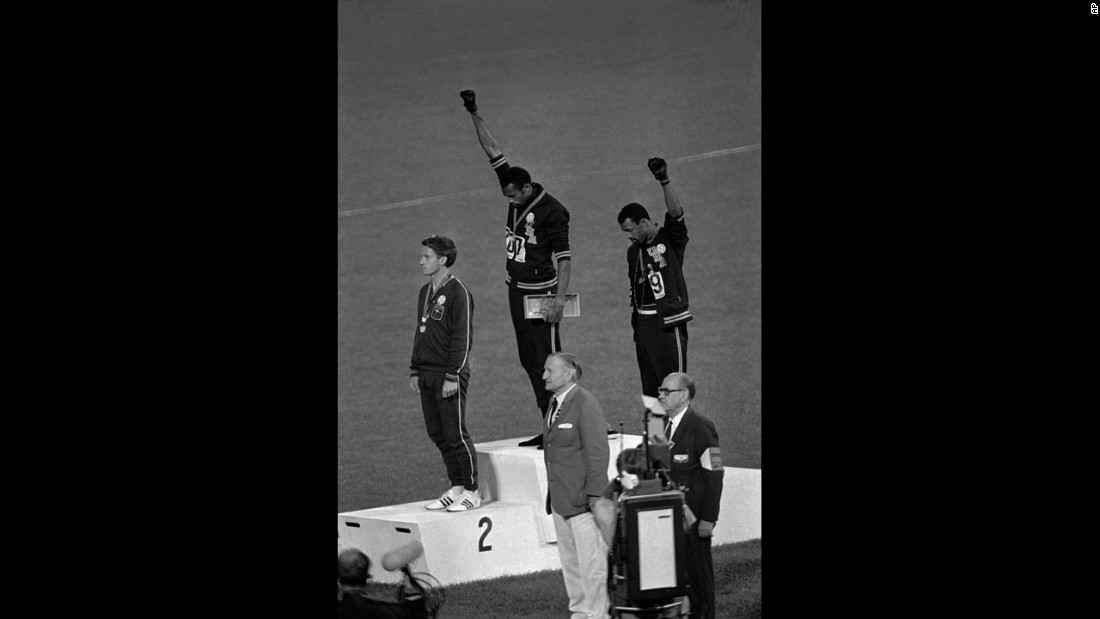 American athletes Tommie Smith, center, and John Carlos raise their fists and hang their heads while the U.S. national anthem plays during their medal ceremony at the 1968 Summer Olympics in Mexico City. Their black power salute became front page news around the world as a symbol of the struggle for civil rights. To their left stood Australian Peter Norman, who &lt;a href=&quot;http://www.cnn.com/2012/08/21/world/asia/australia-norman-olympic-apology/index.html&quot;&gt;expressed his support&lt;/a&gt; by wearing an Olympic Project for Human Rights badge.