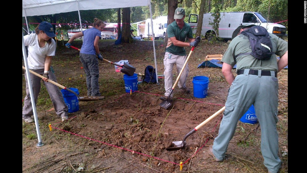 Anthropologists dig on the grounds of the former school in Marianna, Florida.