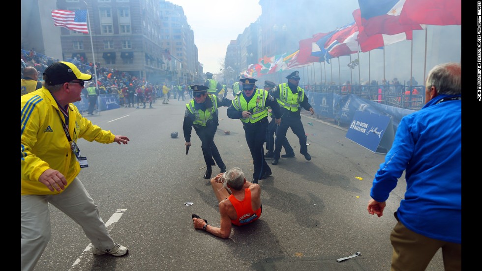 Boston Globe photographer John Tlumacki was near the finish line when 78-year-old runner &lt;a href=&quot;http://piersmorgan.blogs.cnn.com/2013/04/15/bill-iffrig-subject-of-iconic-boston-globe-photo-the-shock-waves-hit-my-whole-body-my-legs-just-started-jittering-around-i-knew-i-was-going-down/&quot;&gt;Bill Iffrig was knocked down&lt;/a&gt; by the first explosion at the Boston Marathon on April 15. The bombings left three people dead and injured more than 100. Iffrig got up and finished the race. Tlumacki&#39;s image of the fallen runner was widely published and selected for the cover of &quot;Sports Illustrated.&quot;