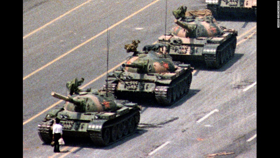 Following a crackdown that resulted in the deaths of hundreds of student demonstrators in Beijing, a lone Chinese protester steps in front of People&#39;s Liberation Army tanks in Tiananmen Squarein 1989. At least five photographers captured the event, which became a symbol of defiance in the face of oppression. Charlie Cole, working for Newsweek, won a World Press Photo Award for his version of the image. The identity and fate of the &quot;Tank Man&quot; remains unclear.