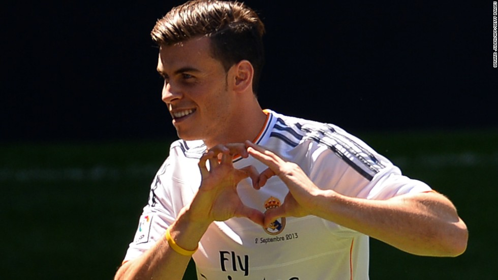 Gareth Bale shows the love for his new club with his recently trademarked heart hand sign.  