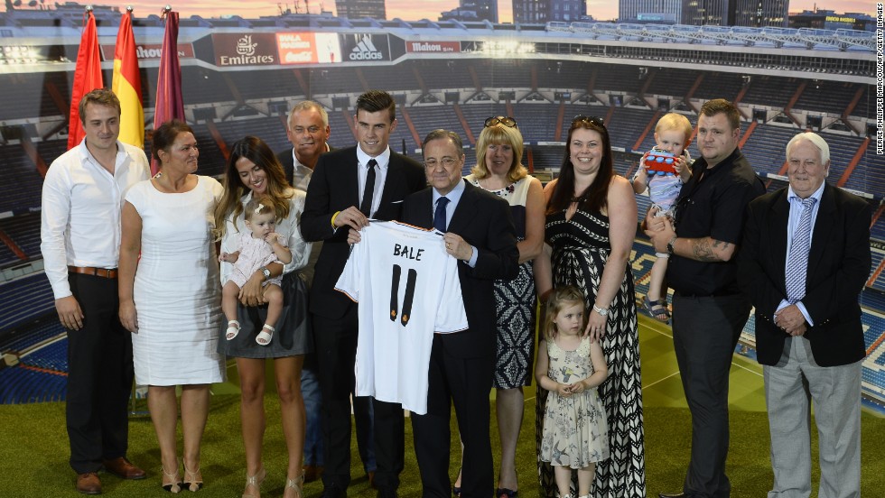Members of Gareth Bale&#39;s family join the Welsh winger following his signing for Real Madrid. Girlfriend Emma Rhys Jones is standing alongside (third left) the playmaker clutching his daughter Alba Violet Jones.
