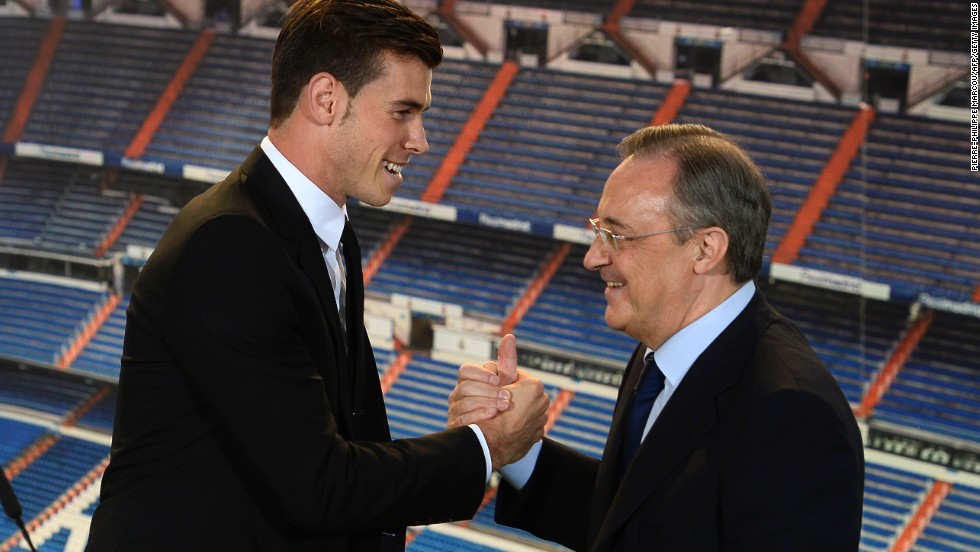 Florentino Perez (right) said Bale will &quot;make the legend of the club greater and stronger&quot; before adding: &quot;This is your stadium, your shirt, your badge and your fans. From today this is your home.&quot;