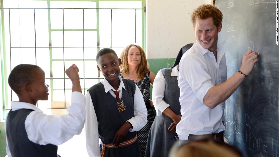 Prince Harry works with children at the Kananelo Centre for the Deaf in Maseru, Lesotho, on February 27. 