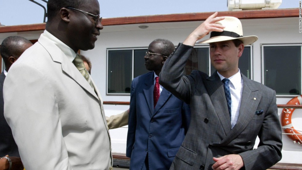 The youngest son of Britain&#39;s Queen Elizabeth II, Prince Edward, right, is greeted by Goree Island Mayor Augustin Senghore upon his arrival at Goree Island, Senegal, on June 6, 2004.