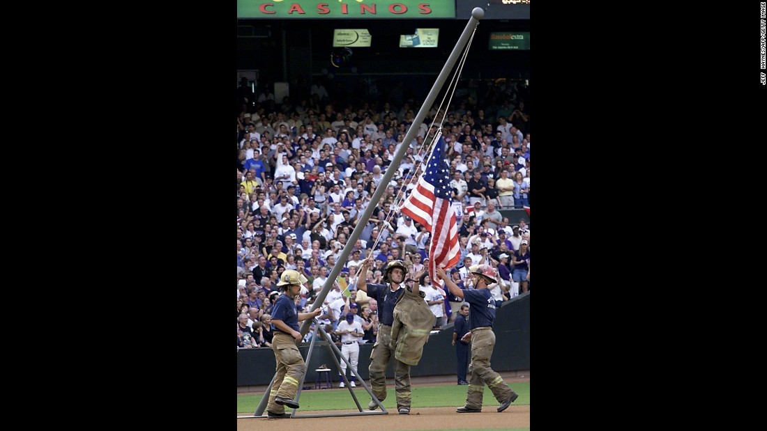 Firemen re-create the flag raising during the 2001 World Series in Phoenix, Arizona, on October 27, 2001.