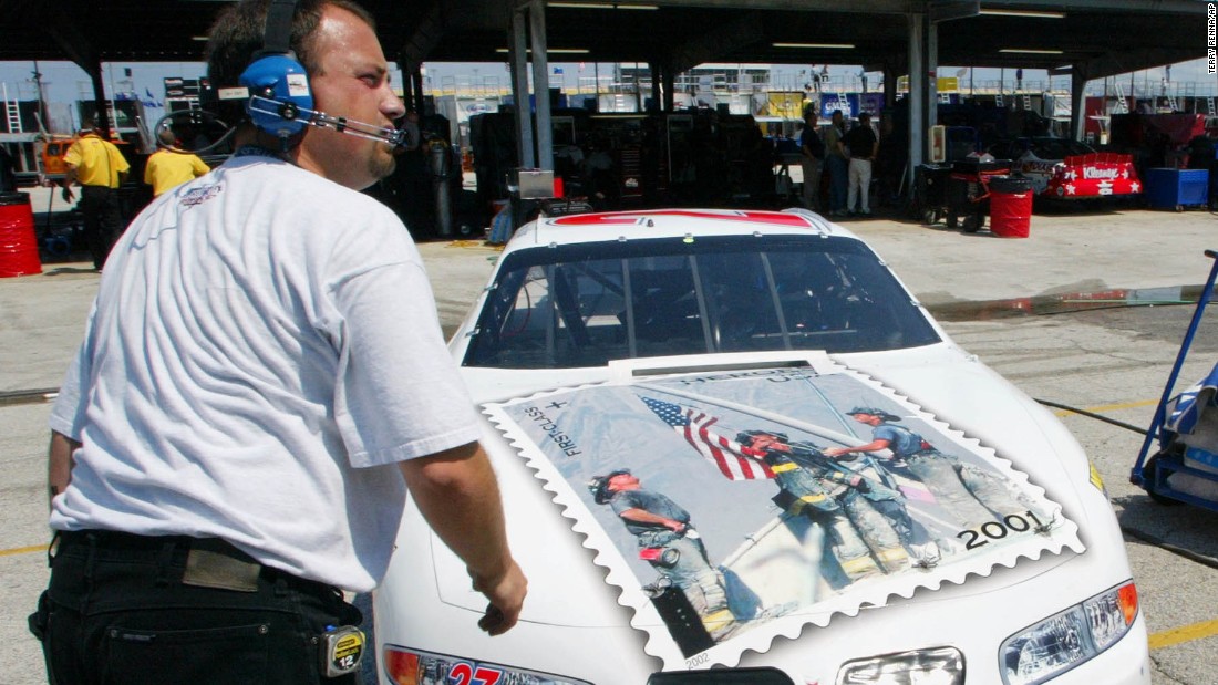 NASCAR driver Jamie McMurray decorated the hood of his car with a replica of the &quot;Heroes of 2001&quot; stamp. A crew member helps ready the car at the Daytona International Speedway in 2002.