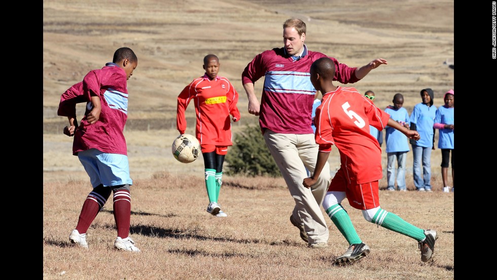 Prince William plays soccer during a visit to a child education center in Semonkong, Lesotho, on June 17, 2010. Whether it&#39;s been to strengthen political ties or to offer humanitarian aid, British royals have a long history of visiting Africa.