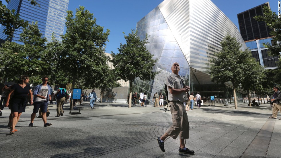 A visitor to the National September 11 Memorial &amp;amp; Museum takes in the sight.