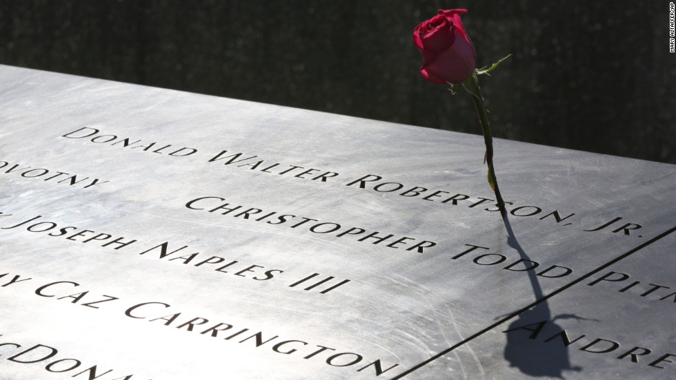 A rose is placed next to the name of a victim of the terrorist attacks on the World Trade Center at the North Pool of the memorial.