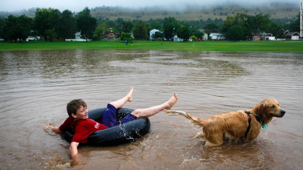 Nicky Toor, 15, floats on the flooded lawn of North Boulder Park in Boulder on September 12.