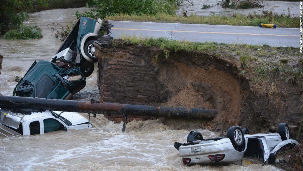 Three vehicles crashed into a creek after the road washed out from beneath them in Broomfield, Colorado, on September 12. Three people were rescued.