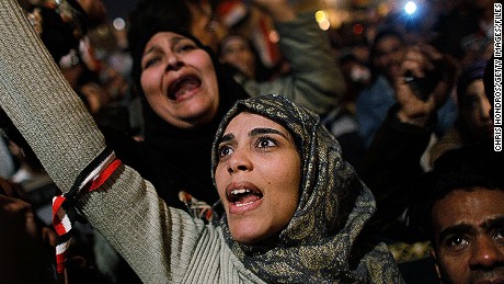 CAIRO, EGYPT - A woman cheers in Tahrir Square after it is announced that Egyptian President Hosni Mubarak was giving up power February 11, 2011 in Cairo, Egypt. After 18 days of widespread protests, Mubarak announced that he would step down. 