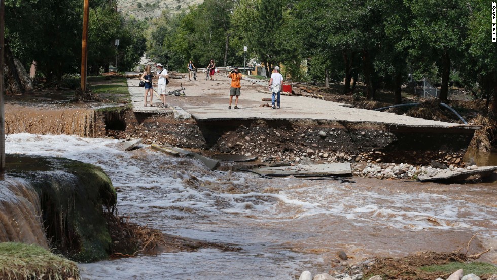 Water rushes where a bridge collapsed in a flash flood in Lyons, on September 13. 