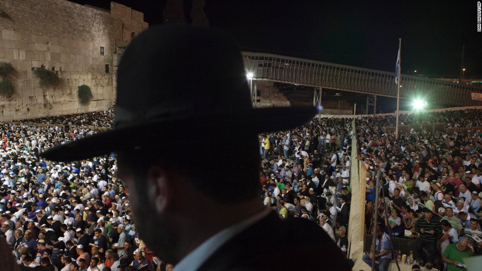 Men and women participate in a Selichot prayer ahead of the Jewish holiday of Yom Kippur at the Western Wall in Jerusalem. Selichot is Hebrew for forgiveness.