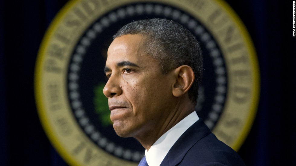 Obama pauses as he speaks in September 2013 about the shooting at the Washington Navy Yard, mourning what he called &quot;yet another mass shooting&quot; that took the life of American patriots. 