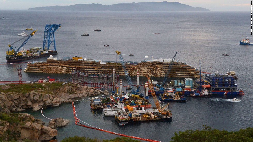 The wreckage of the Costa Concordia cruise ship sits near the harbor of Giglio on Tuesday, September 17, after a &lt;a href=&quot;www.cnn.com/2013/09/15/world/europe/italy-costa-concordia-salvage/index.html&quot; target=&quot;_blank&quot;&gt;salvage crew rolled the ship off its side&lt;/a&gt;. 