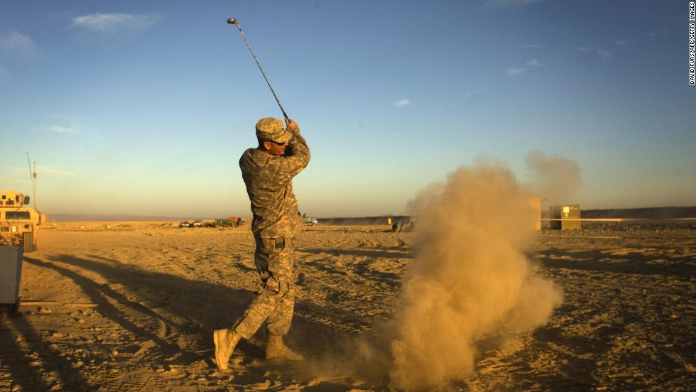 Not all extreme golfing venues are so formal. Here a US Army soldier hits a golf ball at his forward operating base in Paktika province, situated along the Afghan-Pakistan border.