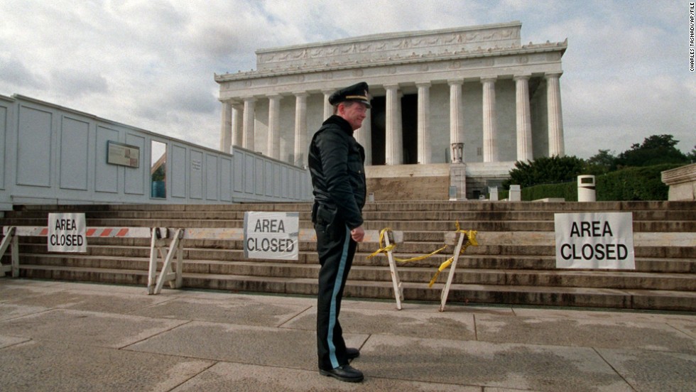 A Park Service police officer stands guard in front of the Lincoln Memorial during a partial shutdown of the federal government in November 1995. Many government services and agencies were closed at the end of 1995 and beginning of 1996 as President Bill Clinton battled a Republican-led Congress over spending levels.