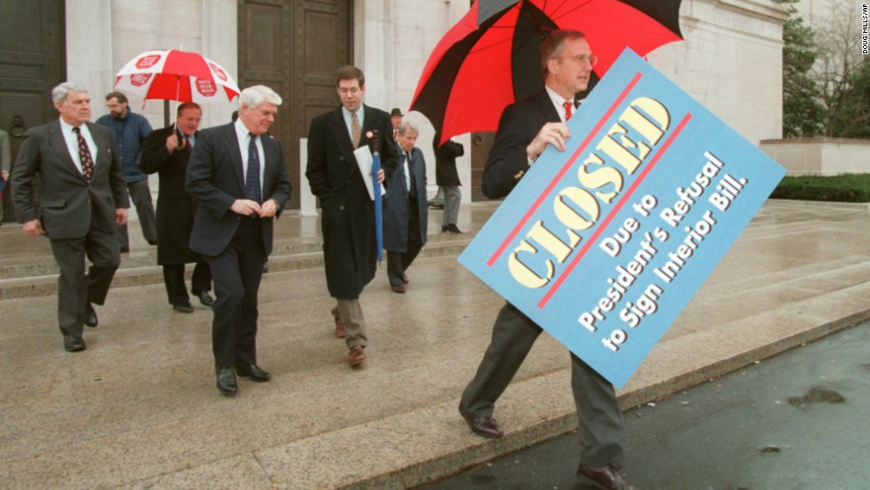 House Appropriations Committee Chairman Rep. Bob Livingston, right, holds a &quot;closed&quot; sign outside the National Gallery of Art in Washington on December 18, 1995.