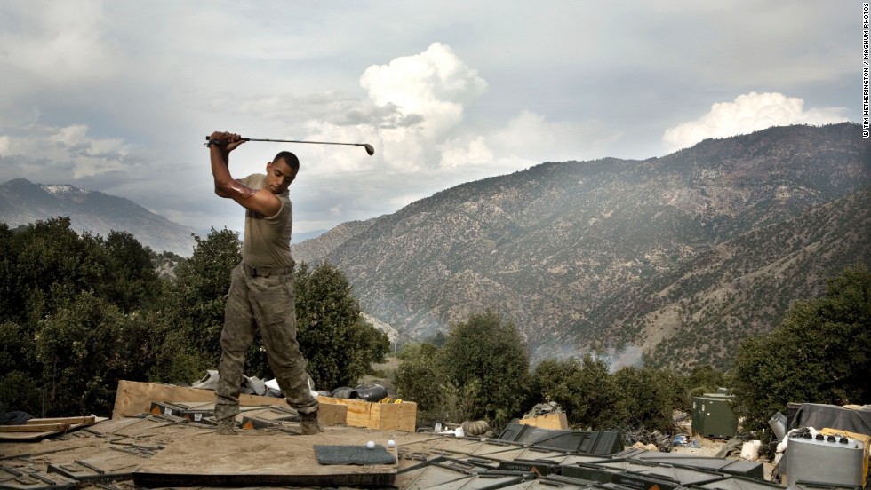 Before his death in 2011, British-American photographer Tim Hetherington spent time taking pictures of a US contingent of soldiers establishing an outpost in northeastern Afghanistan. Now on display at the &lt;a href=&quot;http://www.openeye.org.uk/main-exhibition/tim-hetherington-you-never-see-them-like-this/&quot; target=&quot;_blank&quot;&gt;Open Eye gallery in Liverpool,&lt;/a&gt; Hetherington&#39;s work explores how these soldiers cope with their emotionally draining existence -- in this case by playing on a makeshift driving range. 