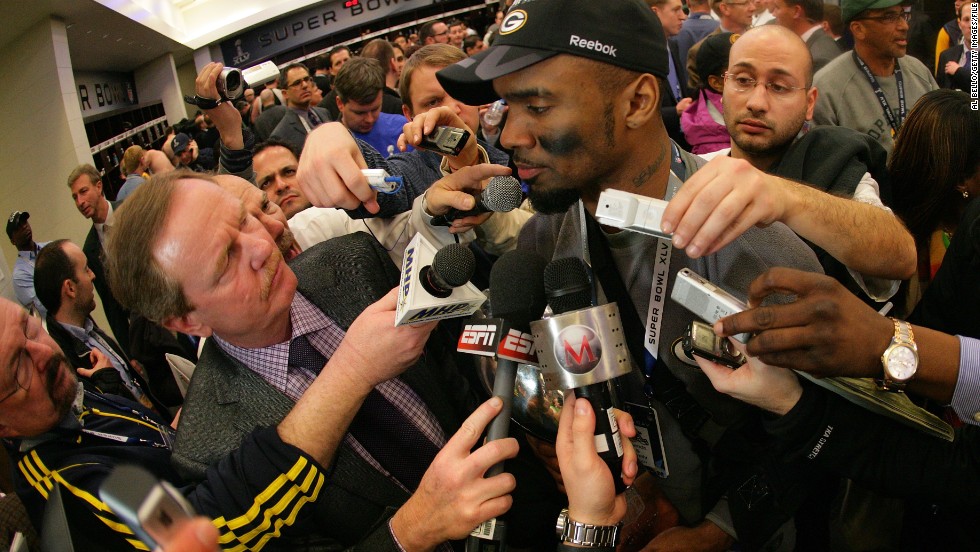 Charles Woodson of the Green Bay Packers fielded questions from a  mob of reporters in the locker room after winning Super Bowl XLV at Cowboys Stadium on February 6, 2011 in Arlington, Texas. 