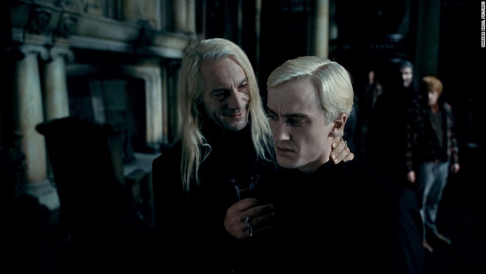 Jason Isaacs, left, as Lucius Malfoy and Tom Felton as the mean and creepy Draco Malfoy in &quot;Harry Potter and the Deathly Hallows -- Part 1.&quot;