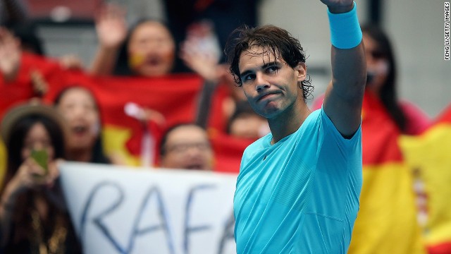 Rafael Nadal acknowledges the crowd in Beijing after Tomas Berdych retires with an injury in their semifinal. 