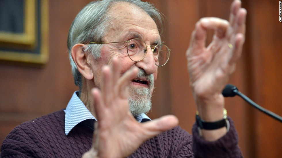Martin Karplus describes molecular behavior as he speaks to reporters at Harvard University in Cambridge, Massachusetts, after being awarded the Nobel Prize in chemistry on October 9.  The three men&#39;s work allows researchers to study chemical reactions, which take place very quickly, at a slower pace using a computer. 